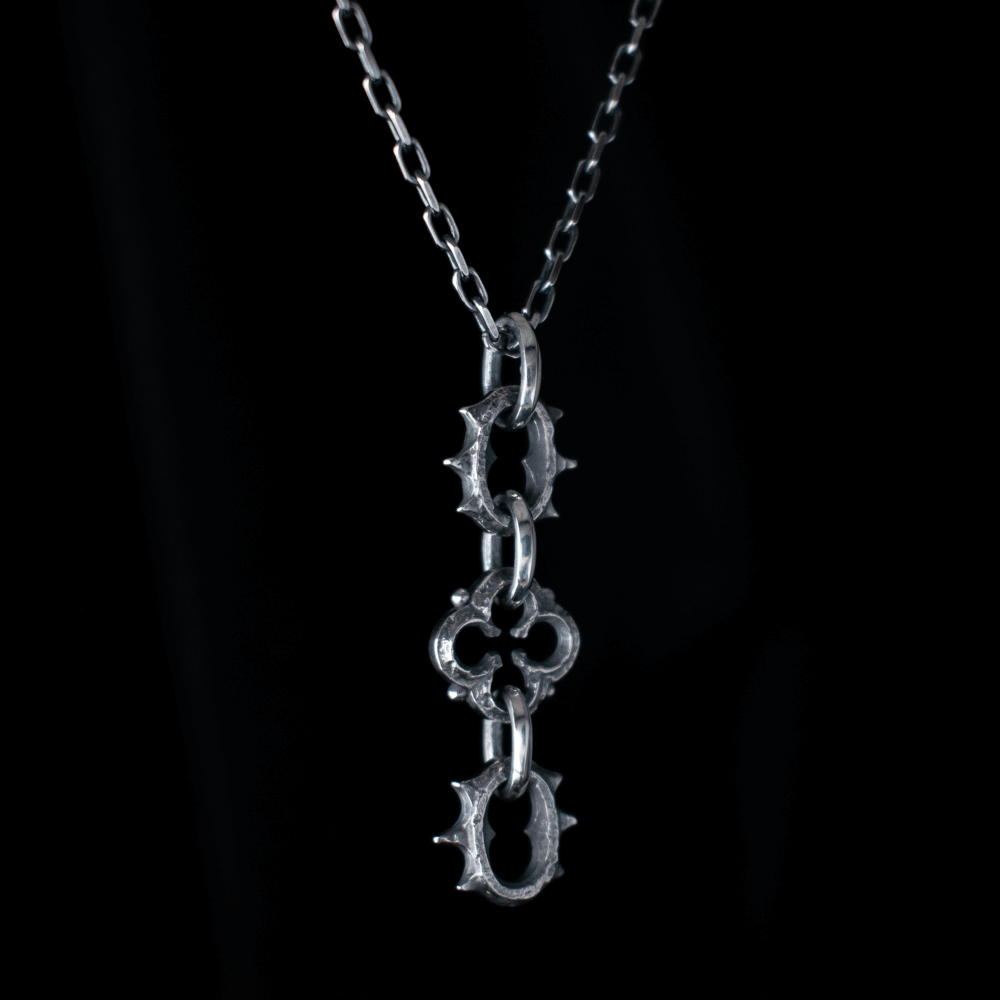 Toilworn Barbed Quatrefoil Pendant